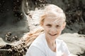 Young girl with wind swept blond hair Royalty Free Stock Photo