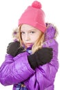 Young girl in winter outfit heaving cold over white background