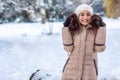 Young girl on a winter walk in winter time at nature.