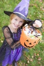 Young girl in witch costume on Halloween