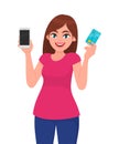 Young girl, woman or female holding/showing mobile, cell, smart phone and credit, debit or ATM card. Modern lifestyle and latest. Royalty Free Stock Photo