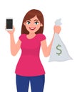 Young girl/woman/female holding or showing mobile, cell, smart phone & money, cash/currency note bag with dollar sign. Modern. Royalty Free Stock Photo