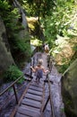 Young girl on wooden stairs, Rock Town Park, Adrspach Teplice, Czech Republic