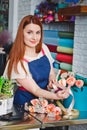 Young girl working in a flower shop Royalty Free Stock Photo