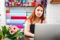 Young girl working in a flower shop Royalty Free Stock Photo