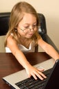 Young girl working at a notebook PC Royalty Free Stock Photo