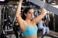 Young girl working out on lat pulldown lever machine Royalty Free Stock Photo