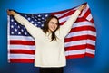 Young girl wrapped in american flag Royalty Free Stock Photo