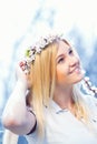 Young girl in a wreath of flowers with apricot Royalty Free Stock Photo