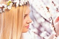 Young girl in a wreath of flowers with apricot Royalty Free Stock Photo