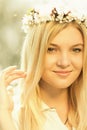 Young girl in a wreath of flowers with apricot Royalty Free Stock Photo