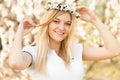 Young girl in a wreath of flowers with apricot Royalty Free Stock Photo