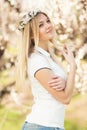 Young girl in a wreath of flowers with apricot Royalty Free Stock Photo