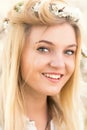 Young girl in a wreath of flowers with apricot Royalty Free Stock Photo