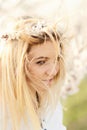 Young girl in a wreath of flowers with apricot Royalty Free Stock Photo