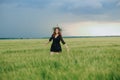 Young girl wreath flowers field dress horizont Royalty Free Stock Photo