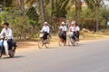 Young girls bicycle home from school