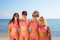 Young girls in bikinis on beach Royalty Free Stock Photo