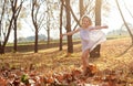 Young girls children kids playing running in fallen autumn leave Royalty Free Stock Photo