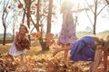 Young girls children kids playing running in fallen autumn leave Royalty Free Stock Photo