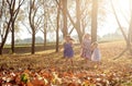 Young girls children kids playing running in fallen autumn leave Royalty Free Stock Photo