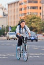 Young girls cycles back home after school, Kunming, China