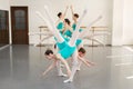 Choreographed dance by a group of graceful pretty young ballerinas practicing during class before performance. Royalty Free Stock Photo