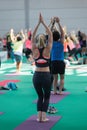 Young Girls doing Yoga Pose and Free Body Gymnastic Exercises at Gym - Fitness Training Royalty Free Stock Photo