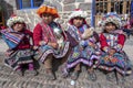 Young girls dressed in traditional Peruvian costume at Pisac in Peru.