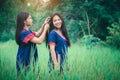 Young girls enjoy playing in the mist of forest outdoor at countryside of Thailand Royalty Free Stock Photo