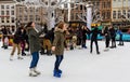 Young girls enjoying skating on an ice rink in central Bruges, Belgium Royalty Free Stock Photo