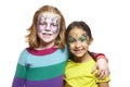 Young girls with face painting of cat and butterfly Royalty Free Stock Photo