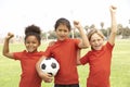 Young Girls In Football Team Celebrating Royalty Free Stock Photo