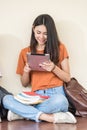 Young girls friend sitting useing with technology Royalty Free Stock Photo