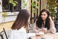 Girls friends chatting over cup of coffee on cafe Royalty Free Stock Photo