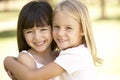 2 Young Girls Giving Each Other Hug Royalty Free Stock Photo