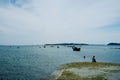 young girls having an afternoon swim close to the local anchorage with beautiful seascape