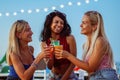 Young girls having a party in a beach - Teenagers drinking cocktails  - Friends having fun in bar Royalty Free Stock Photo