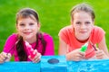 Young Girls Painting Cardboard House Royalty Free Stock Photo