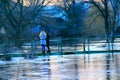Young girls are photographed on background of flooding in spring. Natural disaster Royalty Free Stock Photo