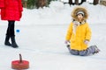 Young girls playing curling