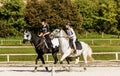 Young girls practice horse back riding