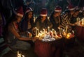 The young girls are praying for Christmas eve with candle lights. Royalty Free Stock Photo