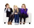 Young girls are sad sitting on couch