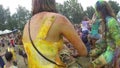 Young girls sitting on boyfriends' shoulders at festival, slowmo