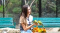 Young girls with small yellow parrot birds