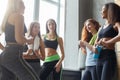 Young girls in sportswear chatting before dancing class Royalty Free Stock Photo