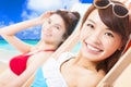 Young girls sunbathing and lying on a beach chair Royalty Free Stock Photo