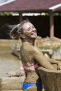 Young girls take mud baths