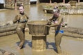 Young girls take mud baths